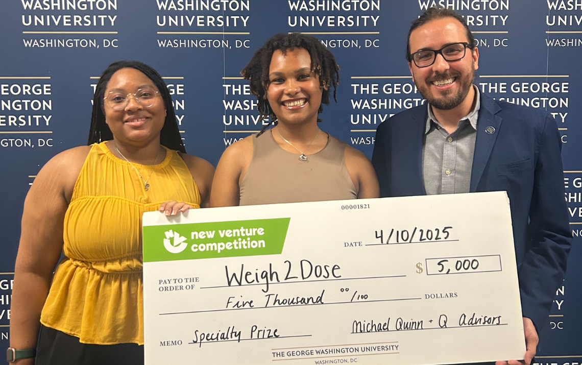 Gazzinelli Lab members holding a large check they were awarded